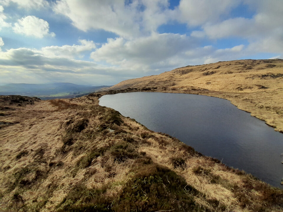 A view of Glandart Lake looking west, over the edge